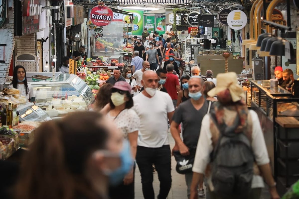 צפוף, בלי מסכות: תמונת מצב בשוק מחנה יהודה