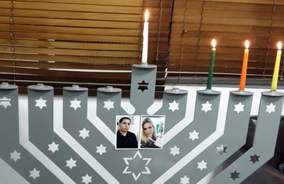 הדלקת נר חנוכה במקום הפיגוע בברקן. צפו
