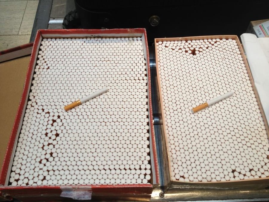 תיירים סינים ניסו להבריח בנתב"ג כ-500 פקטים של סיגריות